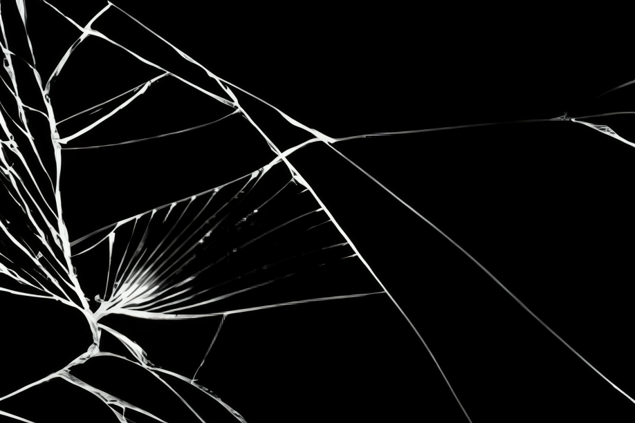 Cracked glass on black background.