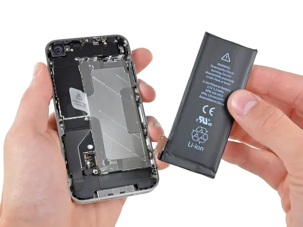 Smartphone with exposed battery and components.