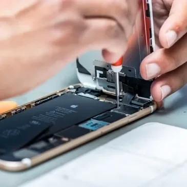 Close-up of a person repairing a phone.